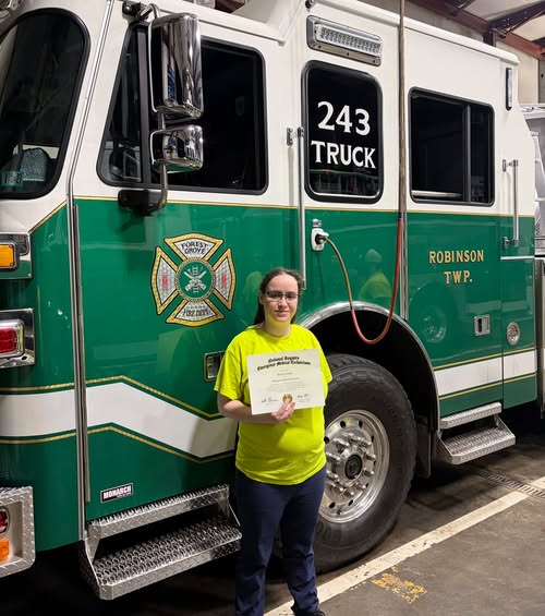 Forest Grove Volunteer Fire Department member Airen Lengyel celebrates earning her National Registry EMT certification